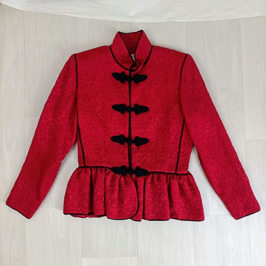 red jacket with frog buttons