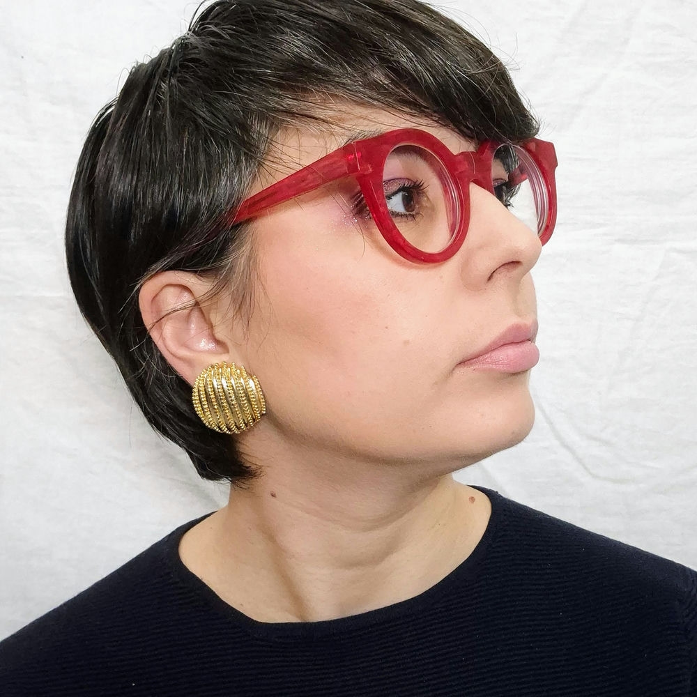 Orecchini dorati vintage 70s con motivo a righe